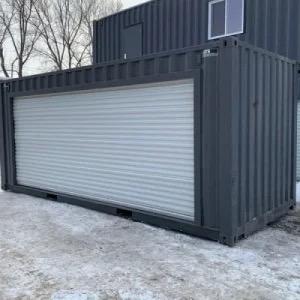 BLACK SHIPPING CONTAINER WITH ELECTRIFIED ROLL UP OPENING