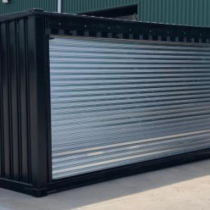 BLACK SHIPPING CONTAINER WITH ELECTRIFIED ROLL UP OPENING